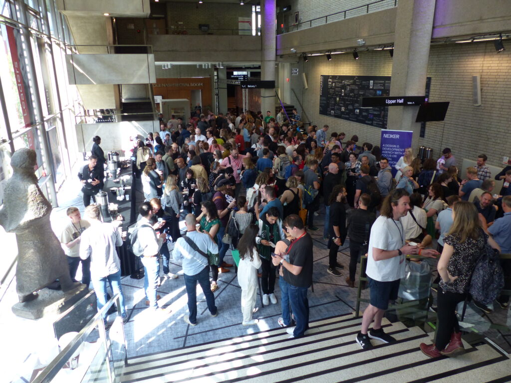 A crowd of people at a conference, where I spoke about helping neurodivergent employees thrive